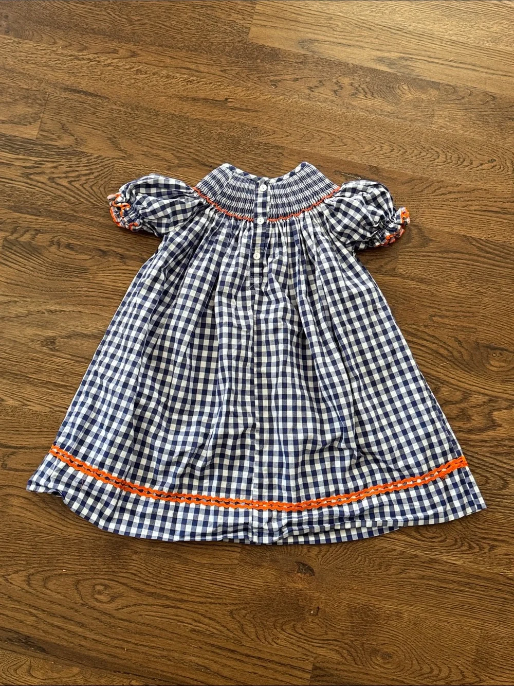 Cecil And Lou Navy Gingham Smocked Dress with Smocked Orange Pumpkin Embroidery